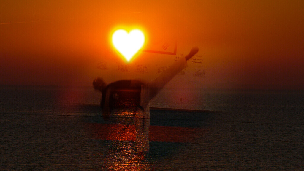 jclay in a love sunset throwing a high round kick