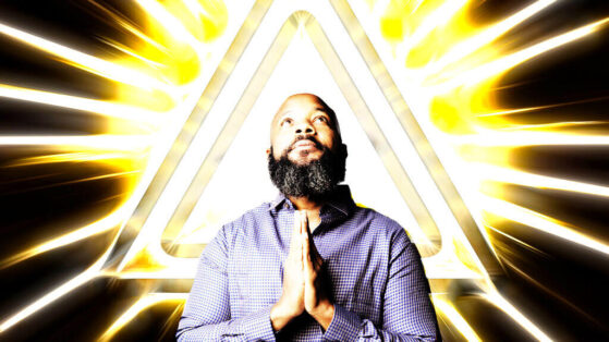 How To Pray & Manifest Effectively jclay brown praying hands with bright light triangle behind him