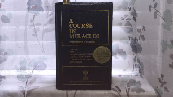 A Course In Miracles (Full Review) A Course In Miracles book on a window sill