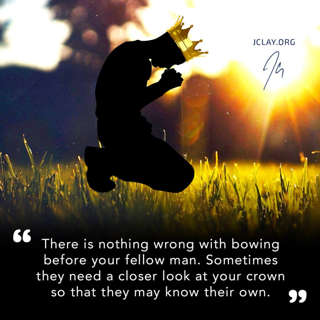 dark man in crown kneeled on gras with motivational jclay quote
