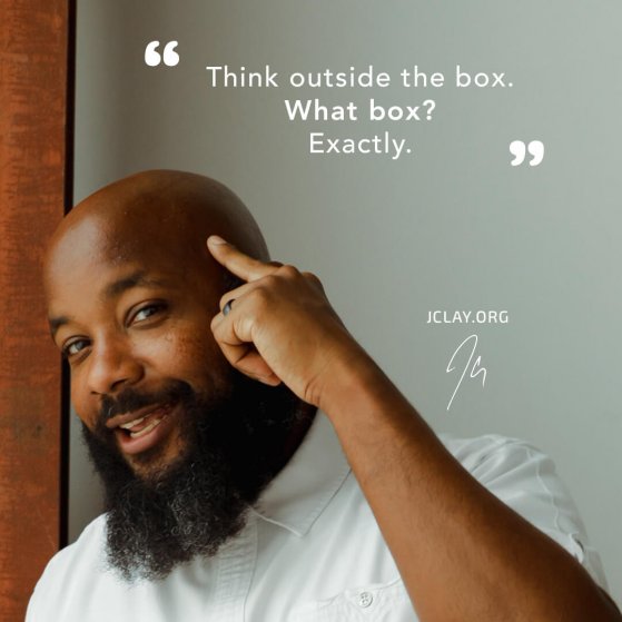 inspiration quote by jclay about thinking outside the box pointing to his head