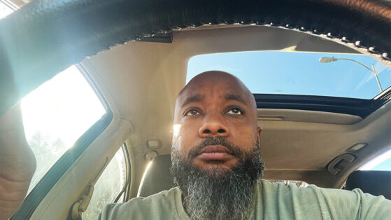 Part 1: Spiritual Lessons from Everyday Frustrations: Traffic Jams, Difficult People, & Technology Fails JClay gripping the steering wheel, looking distraught while stuck in a traffic jam.